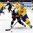HELSINKI, FINLAND - DECEMBER 28: USA's Scott Eansor #14 battles for the puck with Sweden's Oskar Lindblom #23 during preliminary round action at the 2016 IIHF World Junior Championship. (Photo by Matt Zambonin/HHOF-IIHF Images)

